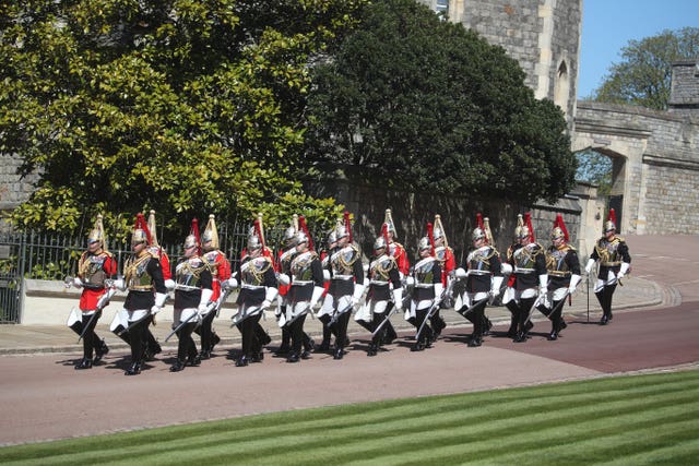 A dismounted detachment of The Life Guards and The Blues & Royals