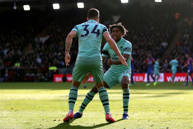 Arsenal’s Granit Xhaka (left) and Alex Iwobi (right) celebrate