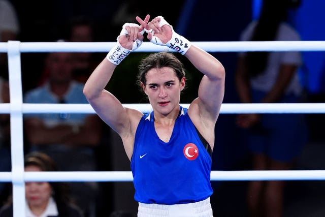 Turkey’s Esra Yildiz Kahraman makes an 'X' symbol with her fingers after losing to Lin Yu-ting