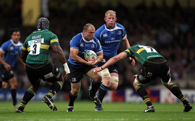 Leinster's Richard Strauss runs into the tackle of Northampton's Phil Dowson during the Heineken Cup final in Cardiff