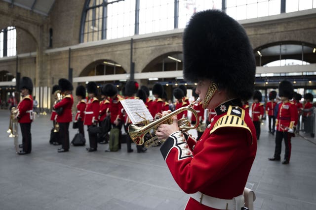 A soldier plays music