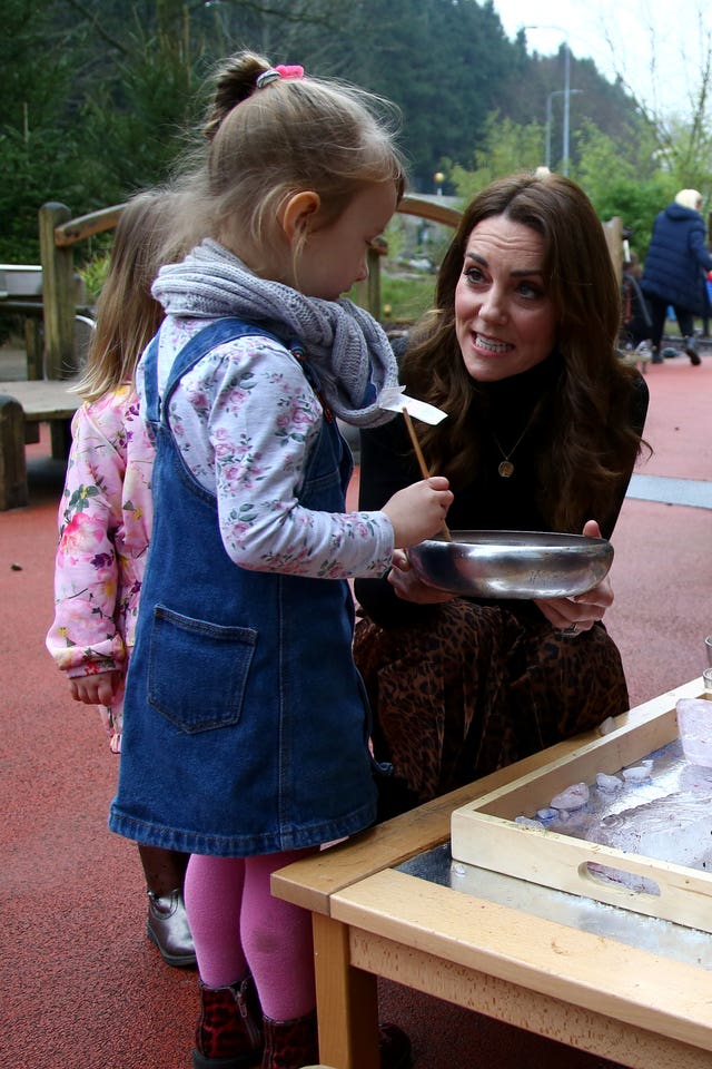 The Duchess of Cambridge playing with children