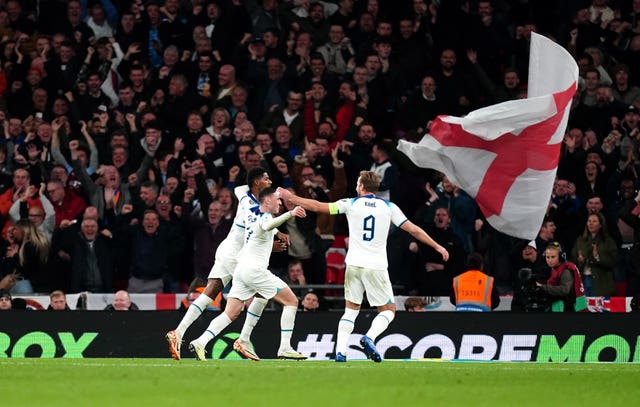 Phil Foden celebrates with Marcus Rashford and Harry Kane