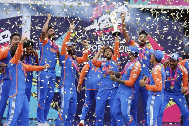 Confetti falls as India players celebrate with the T20 World Cup trophy 