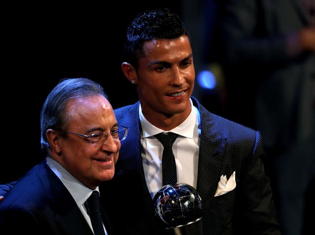 Cristiano Ronaldo, right, celebrates winning last year's award