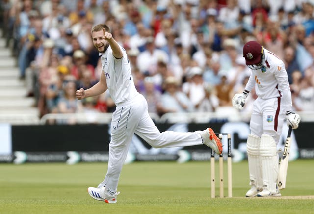 Gus Atkinson (left) celebrates the wicket of West Indies batter Kevin Sinclair at Trent Bridge in July, 2023.