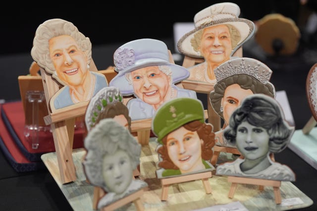 A cake depicting Queen Elizabeth II through the years