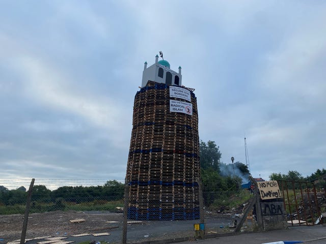 A bonfire with a mock mosque placed on top