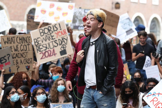 People take part in a protest outside the Department for Education, London, in response to the downgrading of A-level results 