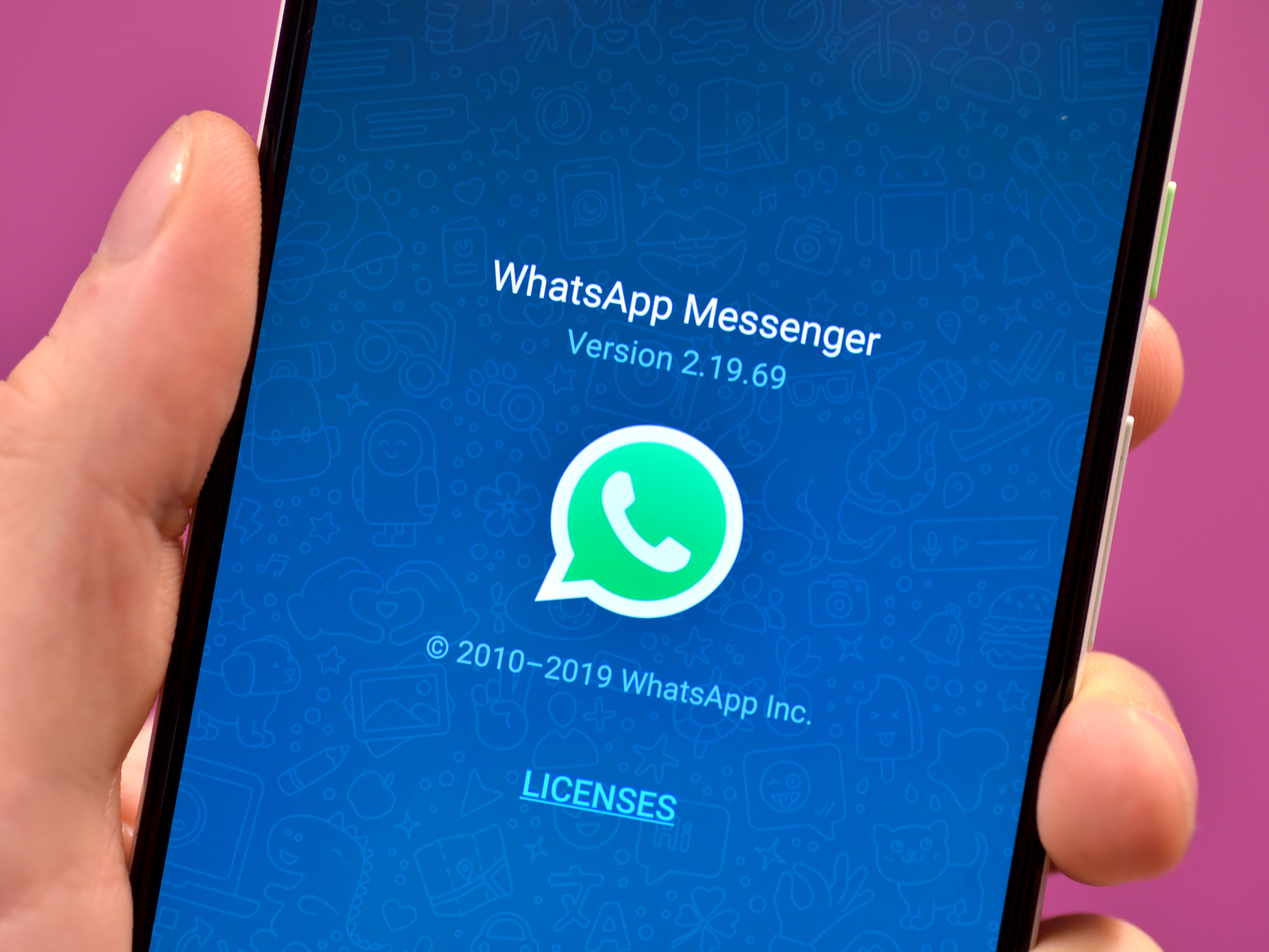 The WhatsApp icon on a smartphone