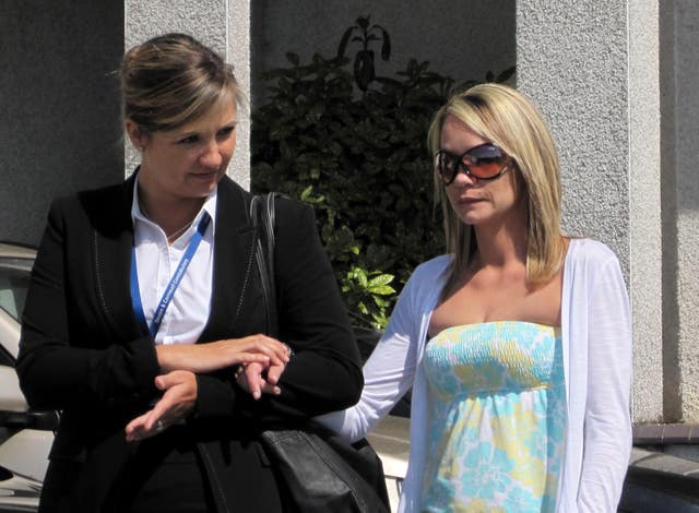 Tina Nash (right) being supported by a police officer outside Truro Crown Court