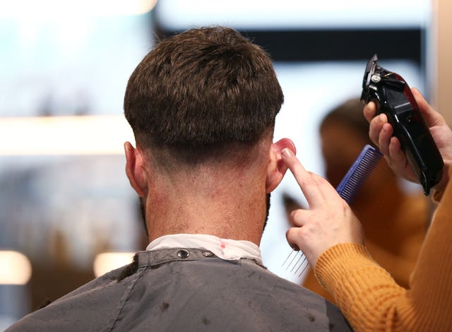 A man getting his hair cut 