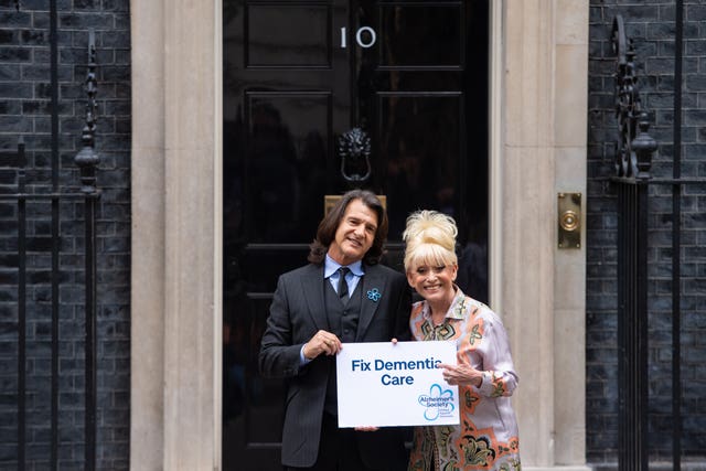 Dame Barbara Windsor and her husband Scott Mitchell deliver an Alzheimer’s Society open letter to 10 Downing Street 