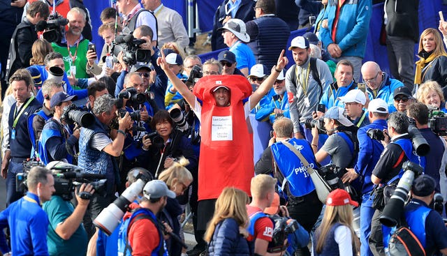 Ian Poulter, centre, celebrates while dressed as a postbox