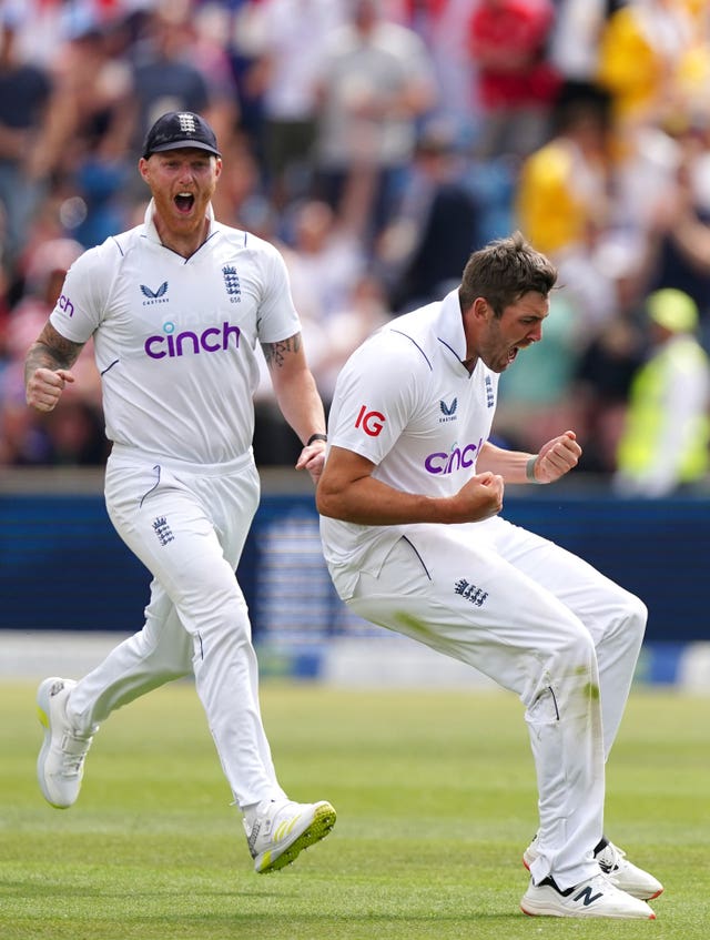 Jamie Overton, right, celebrates the wicket of New Zealand’s Tom Latham