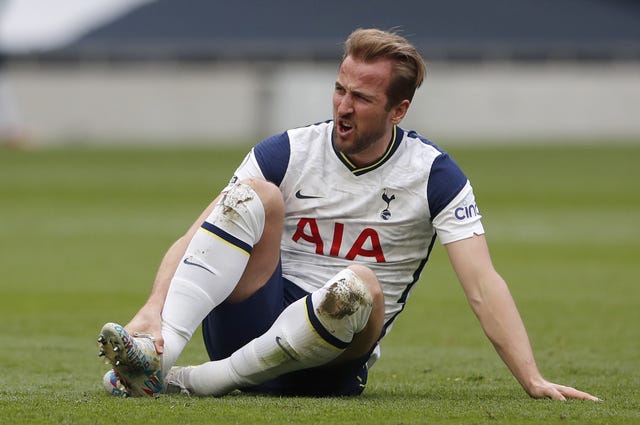 Harry Kane sits on the ground injured
