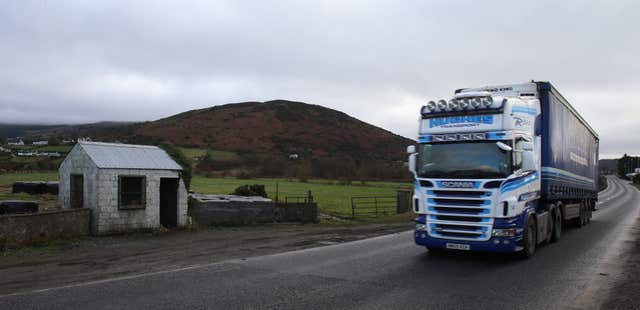 A truck passes a former customs post on the northern side of the Irish border in County Armag