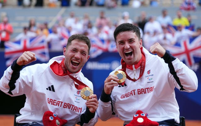 Great Britain’s Alfie Hewett (left) and Gordon Reid receive their gold medals 