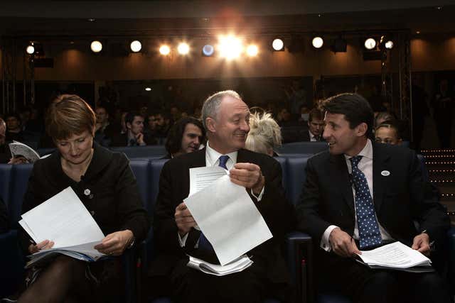 Mayor Ken Livingstone, Tessa Jowell and Sebastian Coe read their speeches as London 2012 unveil their plans for the Olympic and Paralympic games. (Edmond Terakopian/PA)