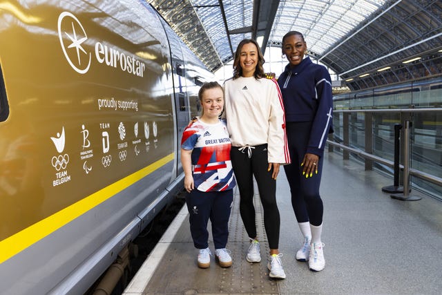 Maisie Summers-Newton, Jessica Ennis-Hill and Perri Shakes-Drayton stand next to a Eurostar Golden Train