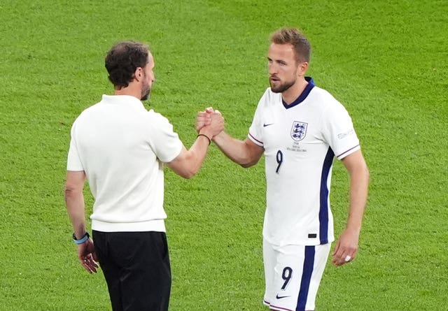 England manager Gareth Southgate greets Harry Kane