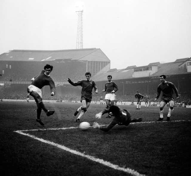 Chelsea goalkeeper Peter Bonetti dives at the feet of George Best in a November 1966 league match