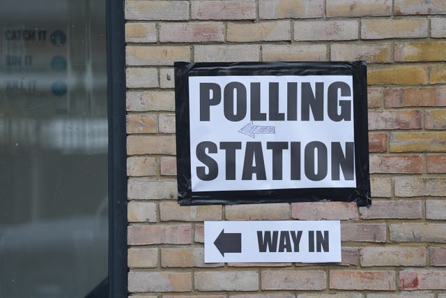 A sign marks the entrance to a polling station