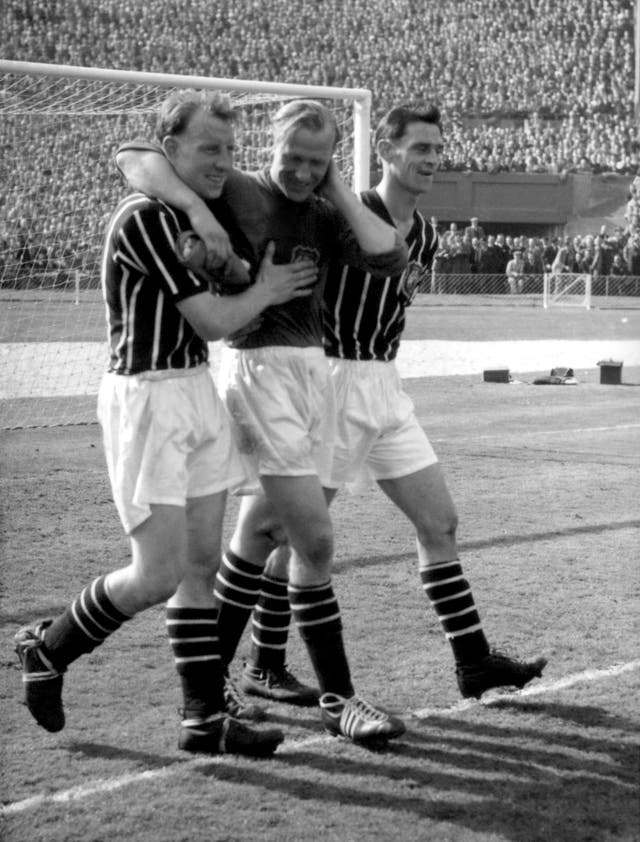 Trautmann (centre) became a City hero with his injury-defying performance in the 1956 FA Cup final