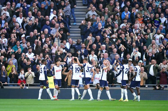 Tottenham’s Son Heung-Min (second from left) smiles after scoring his side''s fourth goal against West Ham, surrounded by team-mates.