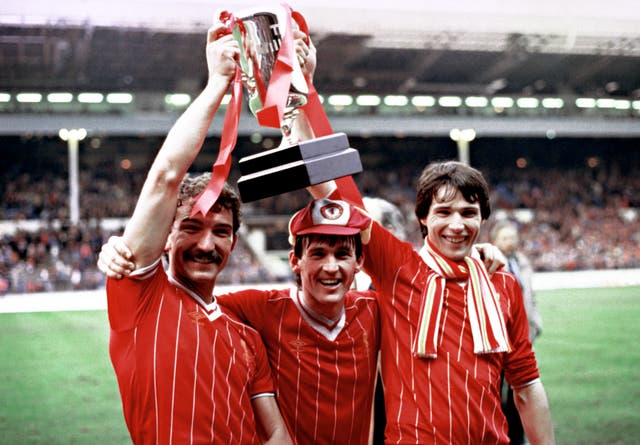 Graeme Souness (left), Kenny Dalglish and Alan Hansen celebrate with the Milk Cup