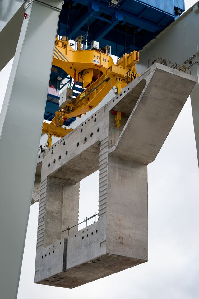 A concrete segment is carried by a crane at the HS2/Align Compound (Aaron Chown/PA)
