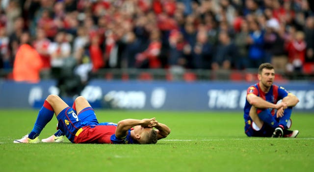 Crystal Palace’s Dwight Gayle and James McArthur slump to the ground in disappointment after losing the 2016 FA Cup final