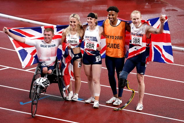 Great Britain's (left-right) Nathan Maguire, Ali Smith, Libby Clegg, guide Chris Clarke and Jonnie Peacock after winning bronze in the universal 4x100m