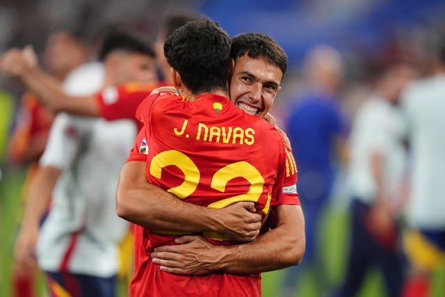 Spain’s Jesus Navas (left) and Martin Zubimendi celebrate after the semi-final victory over France in Munich