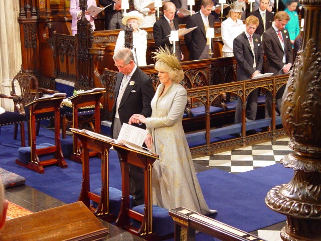 The Prince of Wales, and the Duchess of Cornwall, during their wedding blessing - with Prince Harry watching from one of the stalls (Chris Young/PA)