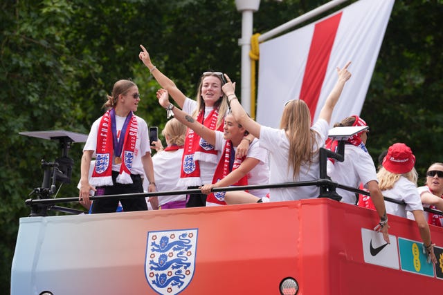 England's players celebrate on the bus