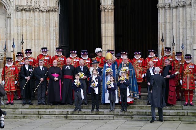 The King and Queen Consort attending the service