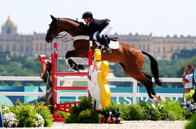 Great Britain’s Laura Collett aboard London 52 on their way to team gold at the Chateau de Versailles