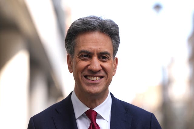Headshot of Ed Miliband smiling while walking outside