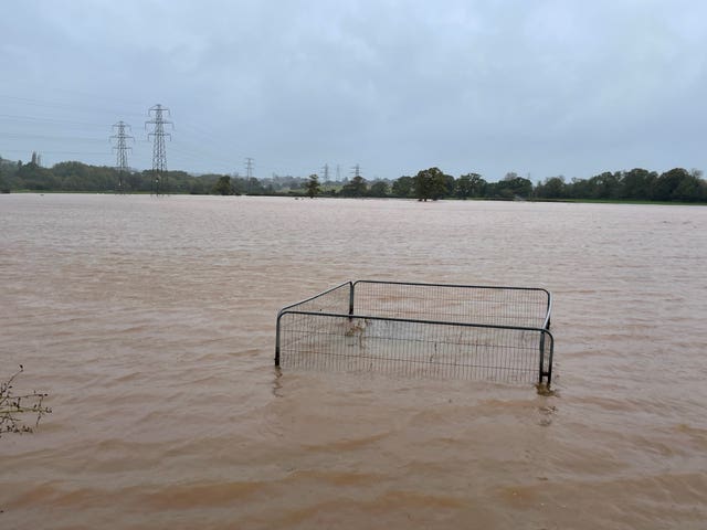 Flood water covers a field after the River Clyde overflowed in Clyst Saint Mary, near Exeter