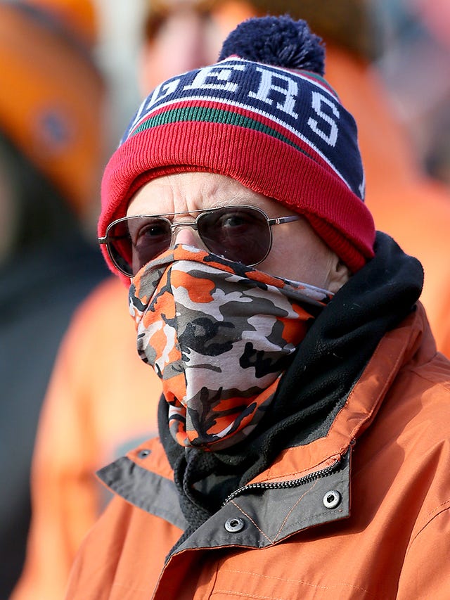 A Castleford supporter wears a mask at the Mend-A-Hose Jungle 