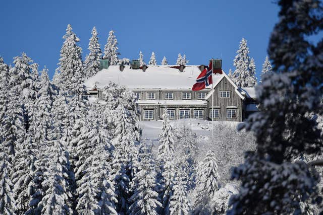 Snow covers a building near the Holmenkollen ski jump in Oslo (Dominic Lipinski/PA)