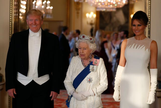 Donald Trump with the Queen and Melania Trump