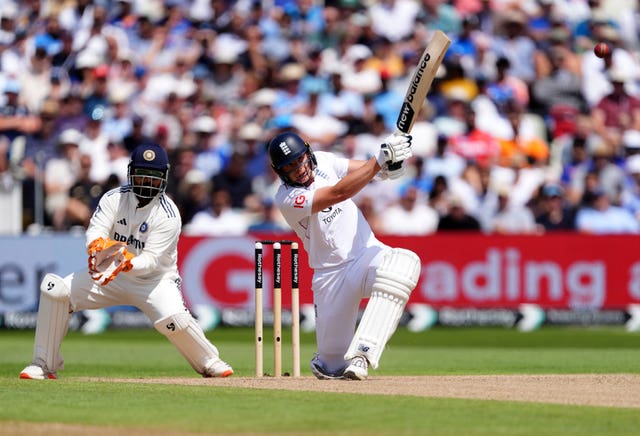 England's Jamie Smith hits a six against India
