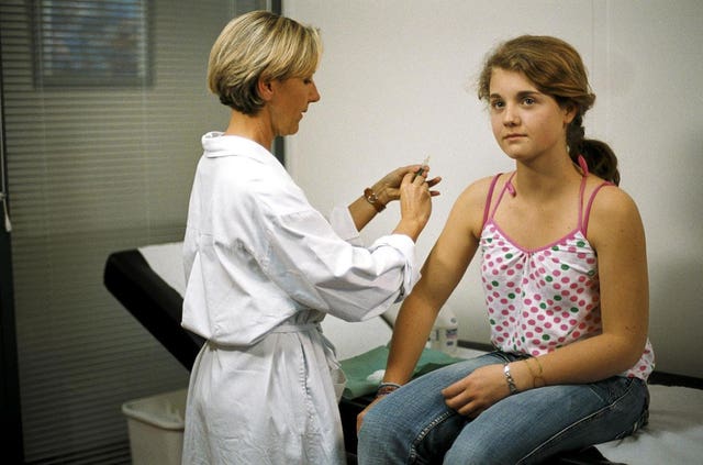 PICTURE POSED BY MODEL. Undated Merck and Sanofi Pasteur handout picture showing a girl receiving one of the human papillomavirus vaccines, Gardasil, which is to be given to girls aged 12 to 13 help protect against cervical cancer. Cervical cancer could be eliminated by widespread HPV vaccination programmes, according to scientists who reviewed studies of 60 million people in affluent countries (Sanofi Pasteur/PA)