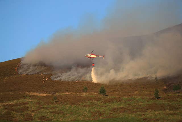 Wildfires burned in places such as Saddleworth Moor in the hot dry conditions (Peter Byrne/PA)