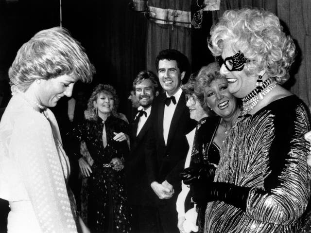 The Princess of Wales enjoying a chat with the flamboyant Dame Edna Everage (alias Barry Humphries) backstage at the Golden Jubilee concert at the London Palladium 