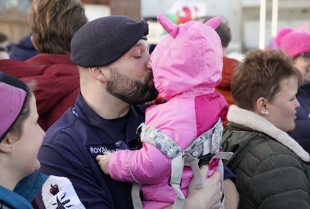 Petty Officer Nicholas Baker holds his daughter Amelia-Rose