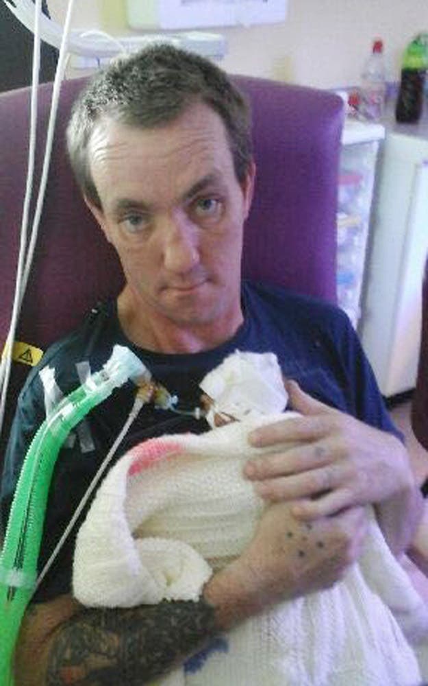 Richard Sheppard holding Amelia Crichton in hospital shortly after her birth (Family handout/PA)