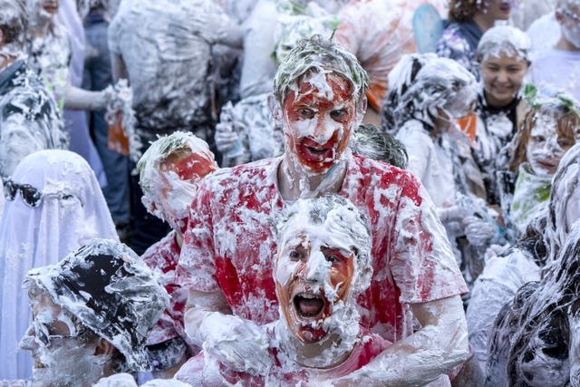 Students covered in makeup and foam